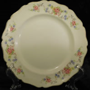 White ceramic plate with roses painted